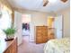 Bedroom featuring a walk-in closet, neutral walls, and access to the upper level of the home at 1935 Shrader Ct, Lawrenceville, GA 30044
