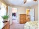 Bedroom showcasing closet and stairway access, and a neutral color palette at 1935 Shrader Ct, Lawrenceville, GA 30044