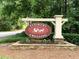 A lovely Flowers Crossing sign surrounded by manicured landscaping at 1935 Shrader Ct, Lawrenceville, GA 30044
