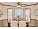 Cozy dining area features a large window with blinds and natural light, ideal for Gathering meals and entertaining at 1935 Shrader Ct, Lawrenceville, GA 30044
