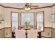 Cozy dining area bathed in natural light from a large bay window, perfect for meals at 1935 Shrader Ct, Lawrenceville, GA 30044