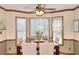 Cozy dining room with a bay window, wood table, and comfortable seating at 1935 Shrader Ct, Lawrenceville, GA 30044