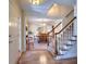 Inviting entryway with hardwood floors, staircase, and view into the formal dining room at 1935 Shrader Ct, Lawrenceville, GA 30044