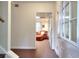 Entryway to a living room featuring neutral walls, carpeted floors, and a view of the seating area at 1935 Shrader Ct, Lawrenceville, GA 30044