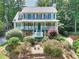 Charming two-story home with a welcoming front porch and beautiful landscaping at 1935 Shrader Ct, Lawrenceville, GA 30044