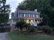 Charming two-story home with a welcoming front porch and well-manicured landscaping at 1935 Shrader Ct, Lawrenceville, GA 30044