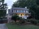 Lovely two-story home featuring a welcoming front porch and mature trees at 1935 Shrader Ct, Lawrenceville, GA 30044