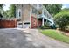 Charming two-story home featuring a two-car garage, brick accents, and a spacious driveway at 1935 Shrader Ct, Lawrenceville, GA 30044
