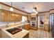 Spacious kitchen with stainless steel appliances, updated countertops, and an island cooktop at 1935 Shrader Ct, Lawrenceville, GA 30044