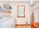 Convenient laundry room with ample shelving and storage for all your laundry needs at 1935 Shrader Ct, Lawrenceville, GA 30044