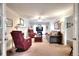 Spacious living room featuring a fireplace, comfortable seating, and a large television at 1935 Shrader Ct, Lawrenceville, GA 30044