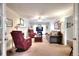 Comfortable living room with a fireplace, plush seating, French doors, and a neutral color palette at 1935 Shrader Ct, Lawrenceville, GA 30044