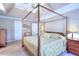 Spacious main bedroom features a tray ceiling, large bed, and ample closet space at 1935 Shrader Ct, Lawrenceville, GA 30044