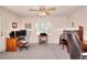 Bright office space with neutral carpeting, desk, computer, piano, and a comfortable chair at 1935 Shrader Ct, Lawrenceville, GA 30044