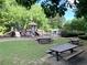 A colorful community playground with picnic tables and a green space at 1935 Shrader Ct, Lawrenceville, GA 30044