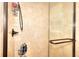 Shower with tan tile, glass doors and shelving at 1935 Shrader Ct, Lawrenceville, GA 30044