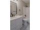 Bathroom features a white vanity and a bathtub with a shower at 4565 English Oaks Ln, Lilburn, GA 30047
