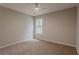 Carpeted bedroom features a double hung window and neutral colored paint at 4565 English Oaks Ln, Lilburn, GA 30047