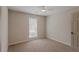 Bedroom featuring neutral walls, carpet, and a window with blinds at 4565 English Oaks Ln, Lilburn, GA 30047