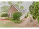 The exterior has a brick wall, tan siding, and a landscaped lawn at 4565 English Oaks Ln, Lilburn, GA 30047