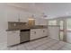 Bright kitchen featuring white cabinets, stainless steel appliances, and granite countertops at 4565 English Oaks Ln, Lilburn, GA 30047