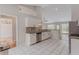 Updated kitchen featuring granite countertops, white cabinets and stainless steel appliances at 4565 English Oaks Ln, Lilburn, GA 30047