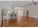 Bright, open-concept floor plan, kitchen with breakfast bar, and hardwood floors at 4565 English Oaks Ln, Lilburn, GA 30047