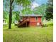 A charming home with backyard, surrounded by lush trees at 551 Barnes Mill Dr, Marietta, GA 30062