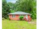 Cozy one-story home with charming front porch and mature trees at 551 Barnes Mill Dr, Marietta, GA 30062
