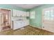 Compact kitchen featuring white cabinets and sink at 551 Barnes Mill Dr, Marietta, GA 30062