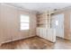 Bright living room with hardwood floors, built in shelving, and natural light at 551 Barnes Mill Dr, Marietta, GA 30062