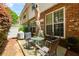 Charming outdoor patio area with seating, ideal for entertaining and relaxation at 559 Woodland Park Ter, Lawrenceville, GA 30043