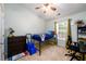 Bedroom featuring a vaulted ceiling, ceiling fan, plush carpet and a window providing natural light at 559 Woodland Park Ter, Lawrenceville, GA 30043