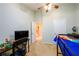 Bedroom featuring natural light, carpeted floors, and a ceiling fan at 559 Woodland Park Ter, Lawrenceville, GA 30043