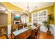 Dining room with a large wooden table and view of the living area at 559 Woodland Park Ter, Lawrenceville, GA 30043