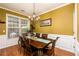 Formal dining room with hardwood floors, chandelier, and traditional decor at 559 Woodland Park Ter, Lawrenceville, GA 30043