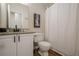 This bathroom includes a granite vanity, framed mirror, and shower with curtain at 861 Soaring Dr, Marietta, GA 30062