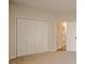 Bedroom with closet, neutral walls and carpet and an adjacent door at 861 Soaring Dr, Marietta, GA 30062