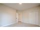 A bedroom offers neutral carpeting, a closet, and a view into an adjoining room at 861 Soaring Dr, Marietta, GA 30062