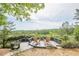 Relax on the wooden deck with picturesque views of the surrounding lush green forest and distant mountains at 861 Soaring Dr, Marietta, GA 30062