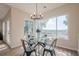 Dining area featuring large windows, glass table, and view of the outdoor landscape at 861 Soaring Dr, Marietta, GA 30062