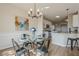 Dining area with modern chandelier, glass table, and close proximity to the kitchen at 861 Soaring Dr, Marietta, GA 30062