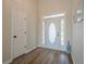 Bright foyer with luxury vinyl flooring, a coat closet, and a white front door with decorative glass at 861 Soaring Dr, Marietta, GA 30062