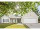 Charming one-story home featuring a well-manicured lawn, a two-car garage, and a welcoming front entrance at 861 Soaring Dr, Marietta, GA 30062