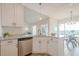 Bright kitchen area with white cabinets, a breakfast bar, and stainless steel appliances at 861 Soaring Dr, Marietta, GA 30062