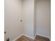 A compact laundry room is equipped with wood-look flooring and a washing machine hookup at 861 Soaring Dr, Marietta, GA 30062