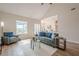 Spacious living room with a vaulted ceiling, backyard access, and a view of the kitchen at 861 Soaring Dr, Marietta, GA 30062