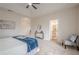 Spacious main bedroom featuring a ceiling fan, plush carpet, and ensuite bathroom entrance at 861 Soaring Dr, Marietta, GA 30062