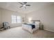 Spacious main bedroom with tray ceiling, carpet, and large window overlooking the landscape at 861 Soaring Dr, Marietta, GA 30062