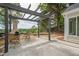 Covered outdoor kitchen area with built-in barbeque and seating perfect for entertaining at 861 Soaring Dr, Marietta, GA 30062